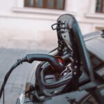 Power supply for hybrid electric car charging battery on urban europe street